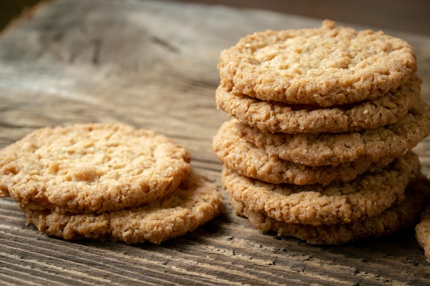 Various tasty cookies biscuits on wooden background