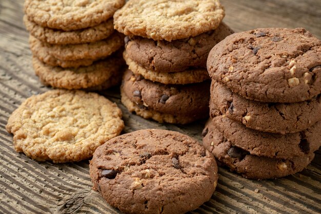 Various tasty cookies biscuits on wooden background