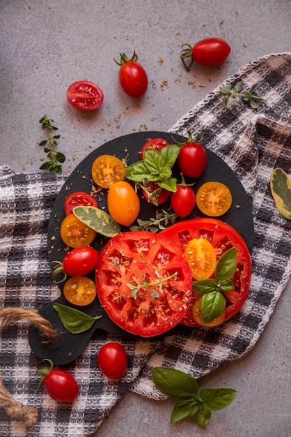 Various tomatoes served with basil Healthy vegetable meal