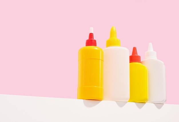 Various tubes of office glue stand on the table Copy space for text