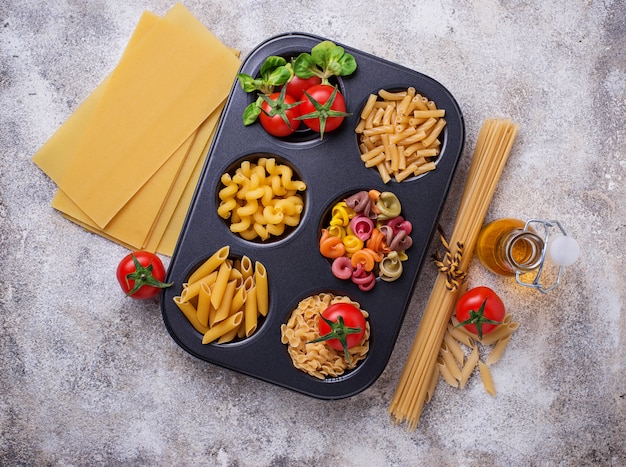 Various type of pasta and cherry tomato