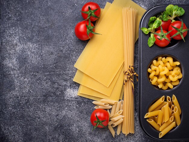 Various type of pasta and cherry tomato