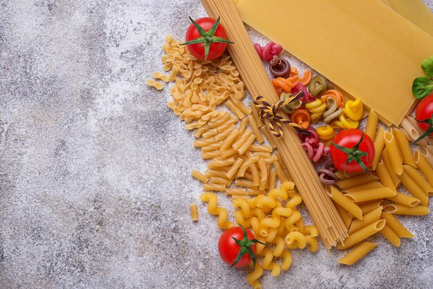 Various type of pasta and cherry tomato