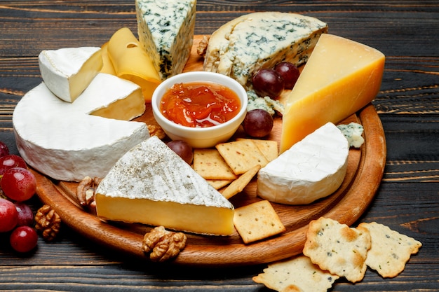 Various types of cheese - parmesan, brie, roquefort, cheddar