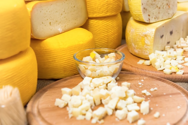 Various types of cheese on wooden desk