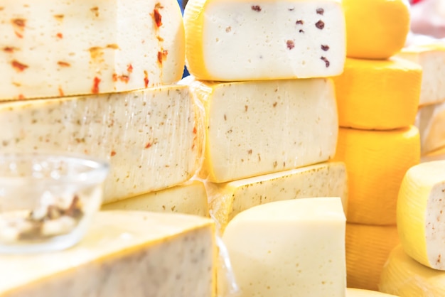 Various types of cheese on wooden desk