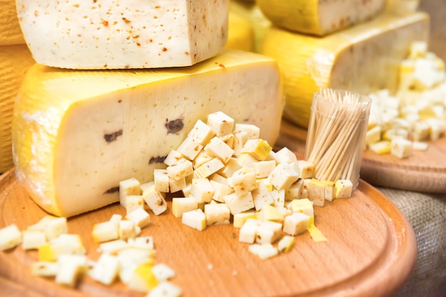 Various types of cheese on wooden desk