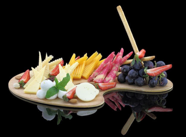 Various types of cheese on a wooden palette