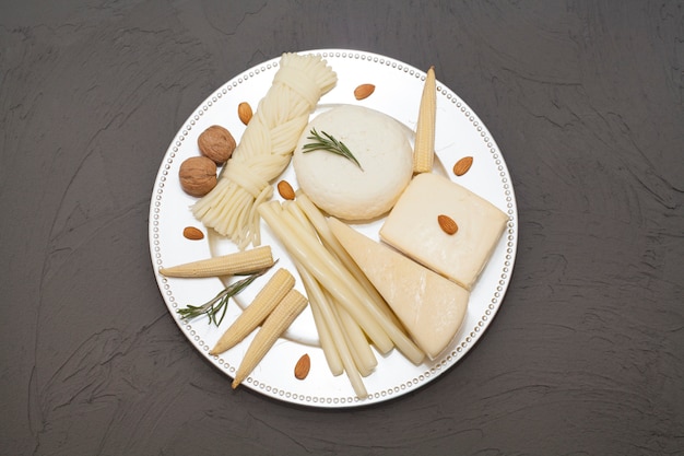 Various types of cheeses on a plate