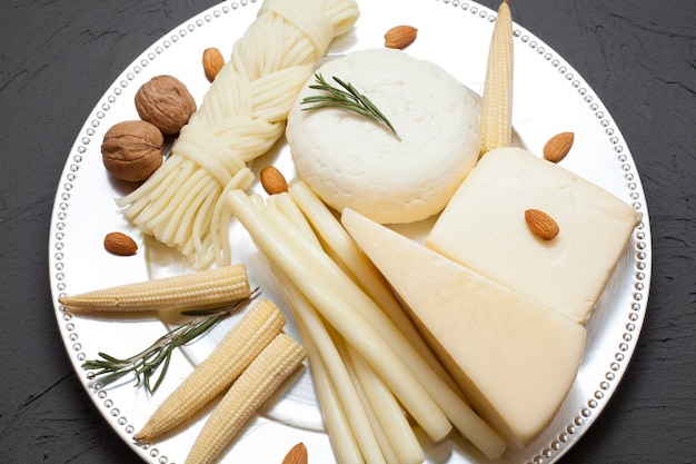 Various types of cheeses on a plate