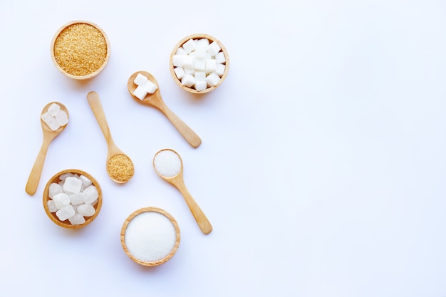 Various types of sugar on white background.