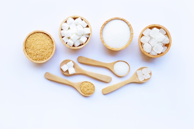 Various types of sugar on white background.