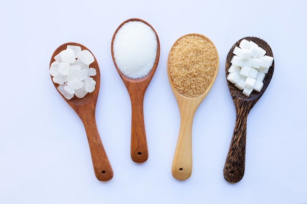 Various types of sugar on white.