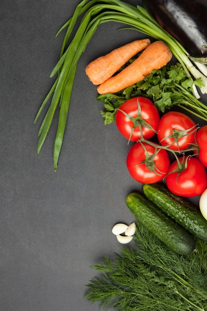 Various vegetables on a wooden dark table with copy space