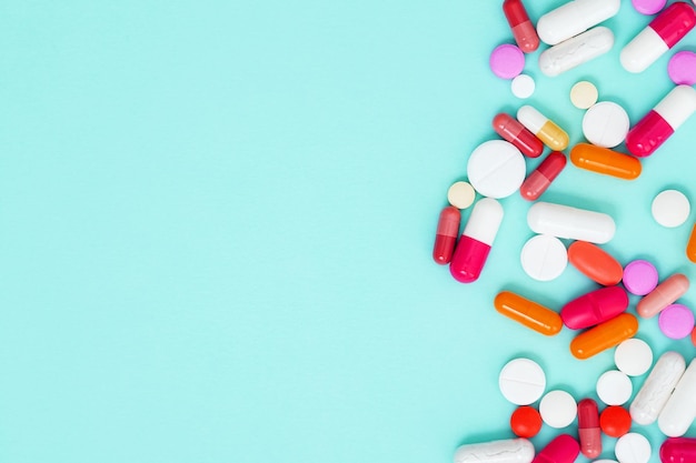 various white medication tablets and capsules concept of healthcare and medicine top view copy space