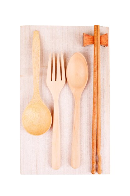 Various wooden kitchen utensils on table top view