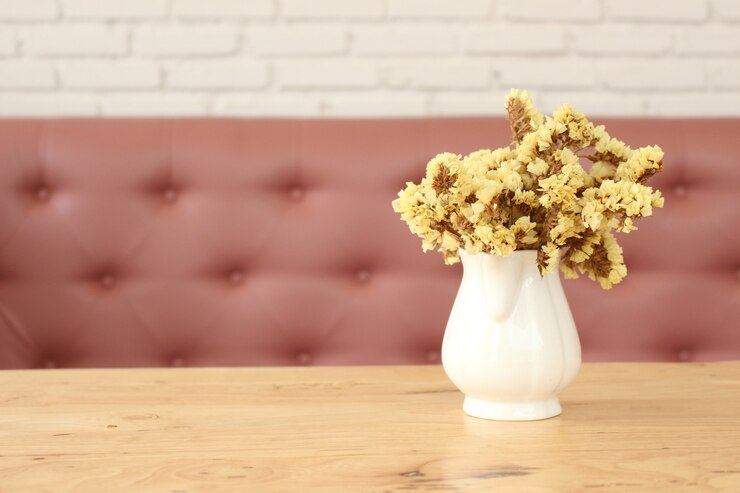 Photo ソファの背景と花の花瓶