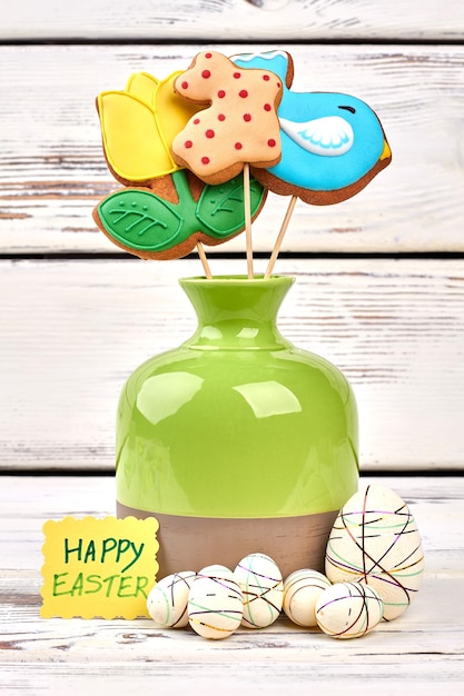 Vase and styrofoam Easter eggs Cookies and greeting card Bouquet for a sweet tooth