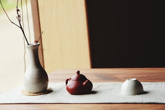 vase and teapot on table
