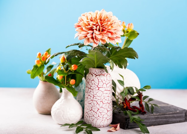 Vase with beautiful chrysanthemum flowers on light table