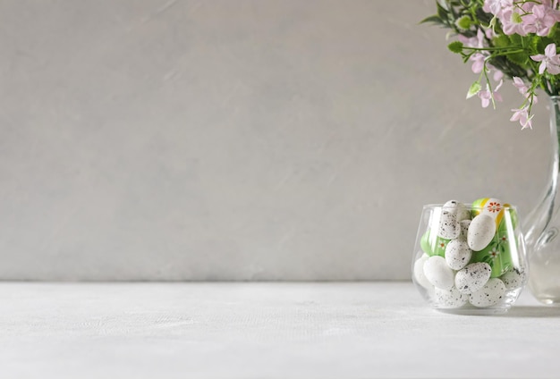 A vase with flowers in it and a white background