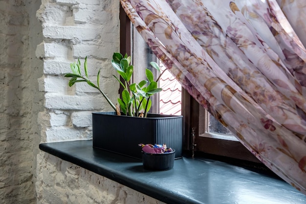 Vase with flowers on windowsill in old vintage style with\
fruits or candles