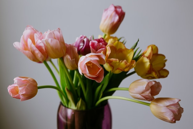 Vase with pink and yellow flowers