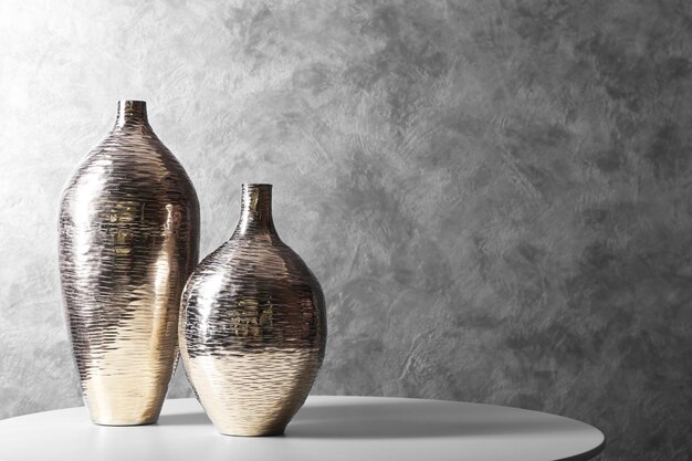 Vases on table in the room