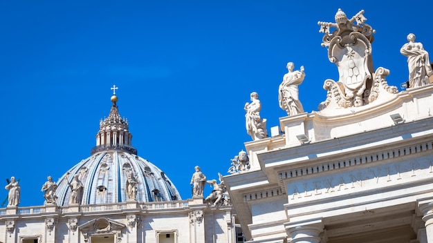 Vatican City in Rome. Detail of Saint Peter Church Cupola on top of Bernini colonnade