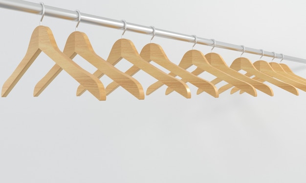 Veel houten hangers op een balk geïsoleerd op een witte achtergrond Concept van shopsaleBusiness fashion