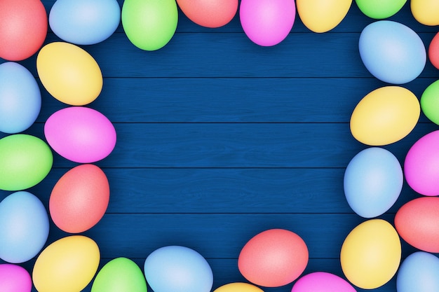 Veelkleurige eieren op een blauwe houten tafel gelukkig Pasen concept kopie ruimte