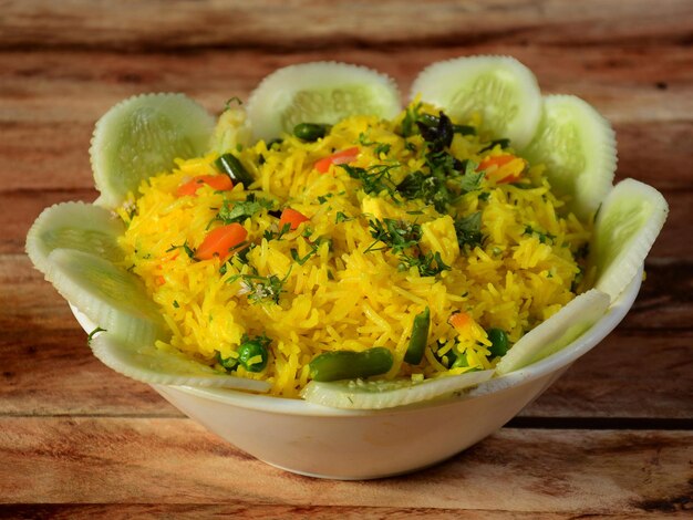 Veg pulao cooked with masala spices served over a rustic wooden\
background selective focus