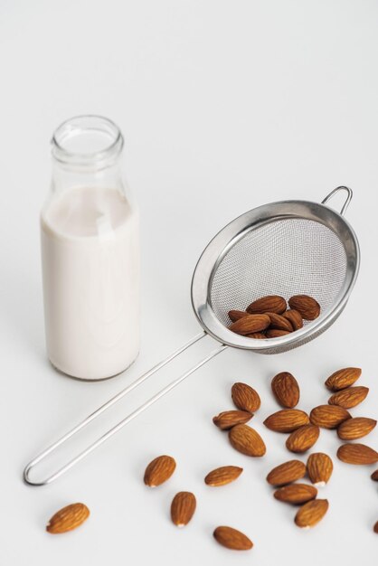 vegan almond milk bottle scattered