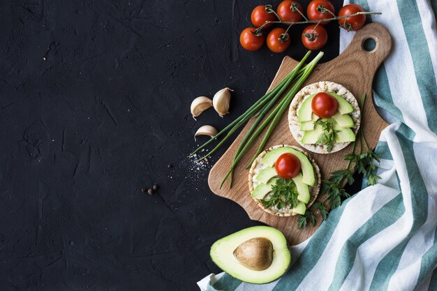 Vegan breakfast rice tortillas avocado tomato spices onions