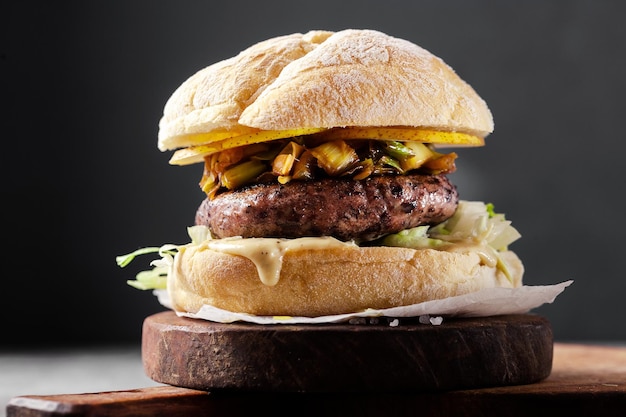 Vegan burger with black rice cutlet and fried leeks Healthy cuisine fast food