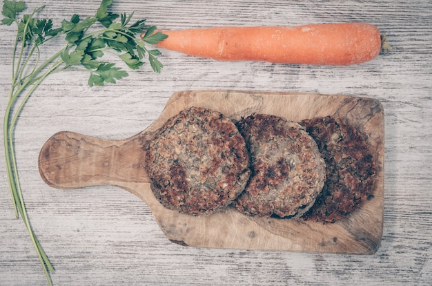  Vegan burger with lentils. Vegan dish Healthy. Wooden background