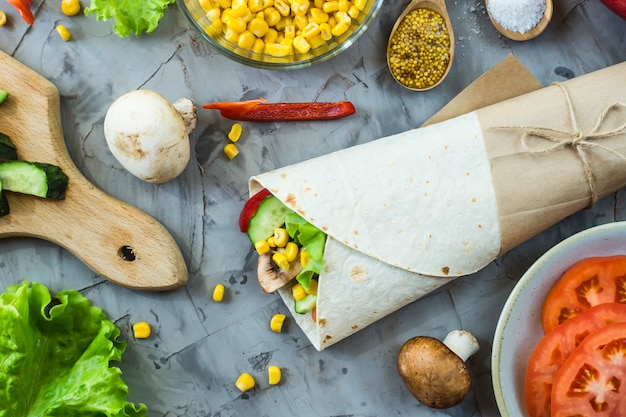 Vegan burrito from vegetables, mushrooms and tortillas