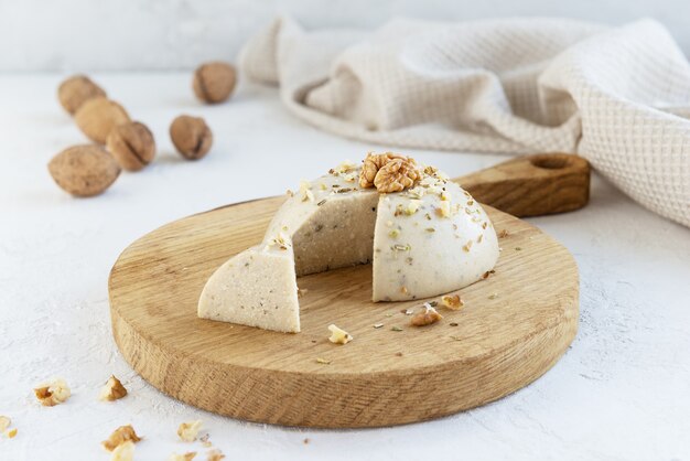 Vegan cashew cheese on a wooden board