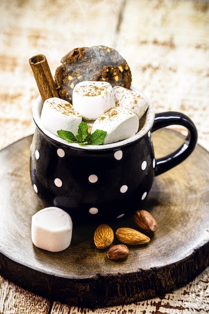 Vegan Christmas hot chocolate made with chestnuts, vegetable milk, cocoa, cinnamon and mint. Hot healthy drink to warm winter