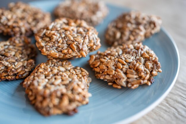 Vegan cookies made of banana and different seeds photographed with natural light