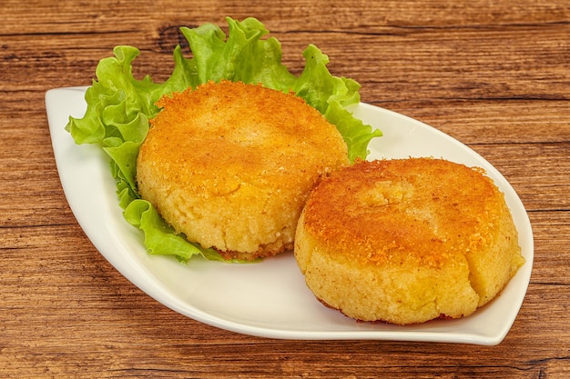 Vegan cuisine Potato cutlet in the plate