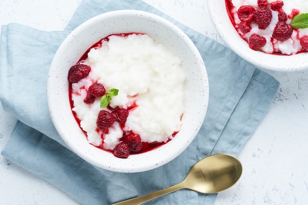 Vegan diet breakfast with coconut milk, raspberry, scandinavian