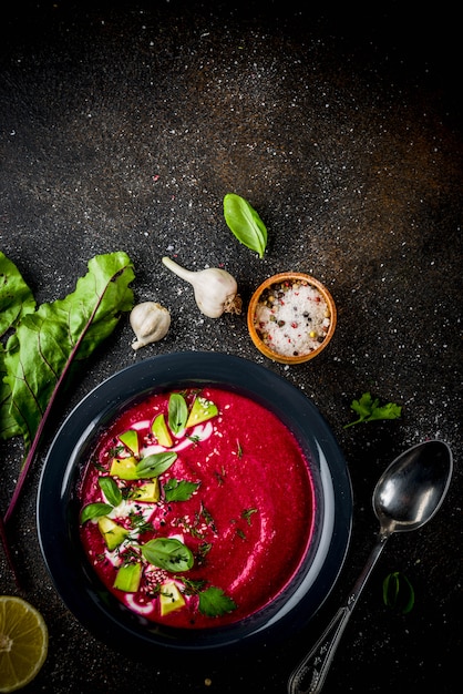 Vegan food, summer cold Beetroot gazpacho soup with lemon, avocado