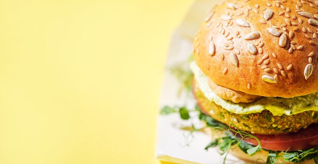 Photo vegan homemade burger with gluten-free bun and vegetable-based cutlet