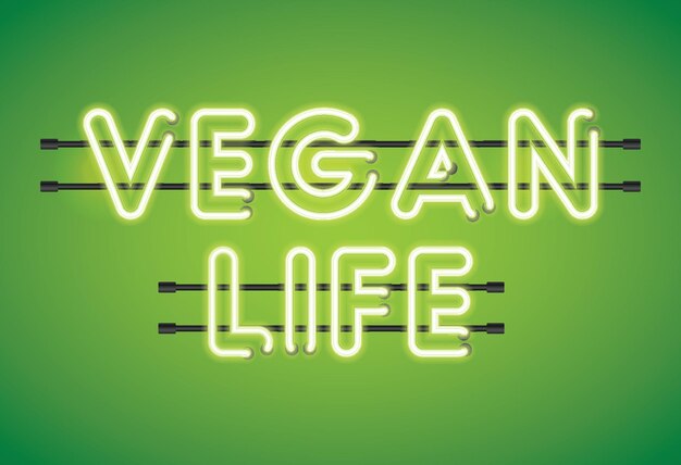 Foto vegan life neon tl-verlichting bericht op een groene achtergrond