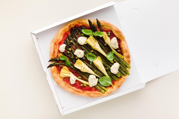 Vegan pizza asparagus in a box for delivery advertising or menu