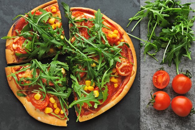 Vegan pizza with fresh arugula. Healthy food.