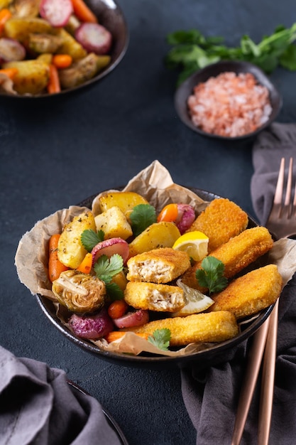 Vegan plant based fish fishless fingers with roasted vegetables