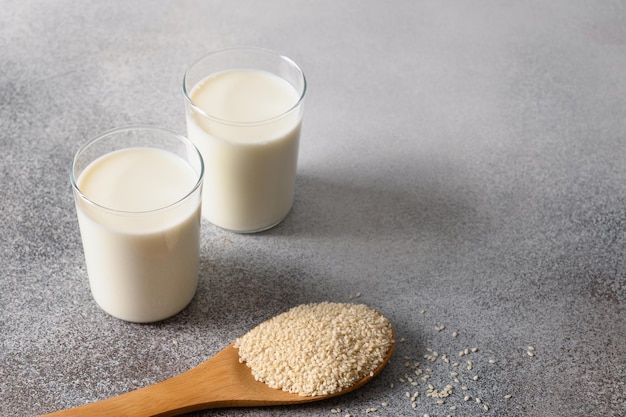 Vegan plant based sesame milk on gray background