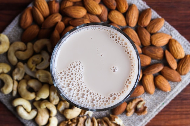 Vegan plantbased nut milk Healthy food concept lactose free food Top view closeup selective focus